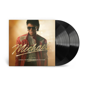 Album cover for Michael: Songs From the Motion Picture, showing a man in a red jacket and sunglasses with two vinyl records beside him.