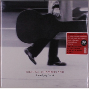 Album cover: a person walks with a large guitar case in black-and-white, red sticker with track titles visible; ‘Chantal Chamberland’ ‘Serendipity Street’ label at bottom.