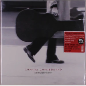 Album cover: a person walks with a large guitar case in black-and-white, red sticker with track titles visible; ‘Chantal Chamberland’ ‘Serendipity Street’ label at bottom.