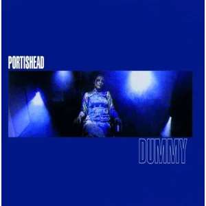 Portishead album cover with a blue-toned scene and a person in a chair, title 'DUMMY' visible at right.