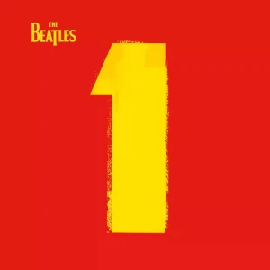 Album cover showing The Beatles logo in yellow on a red background with a large yellow numeral 1 in the center.