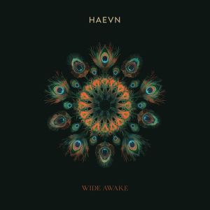 Album cover featuring a vibrant, circular peacock feather mandala in teal and orange on a black background, with 'HAEVN' at the top and 'WIDE AWAKE' at the bottom.